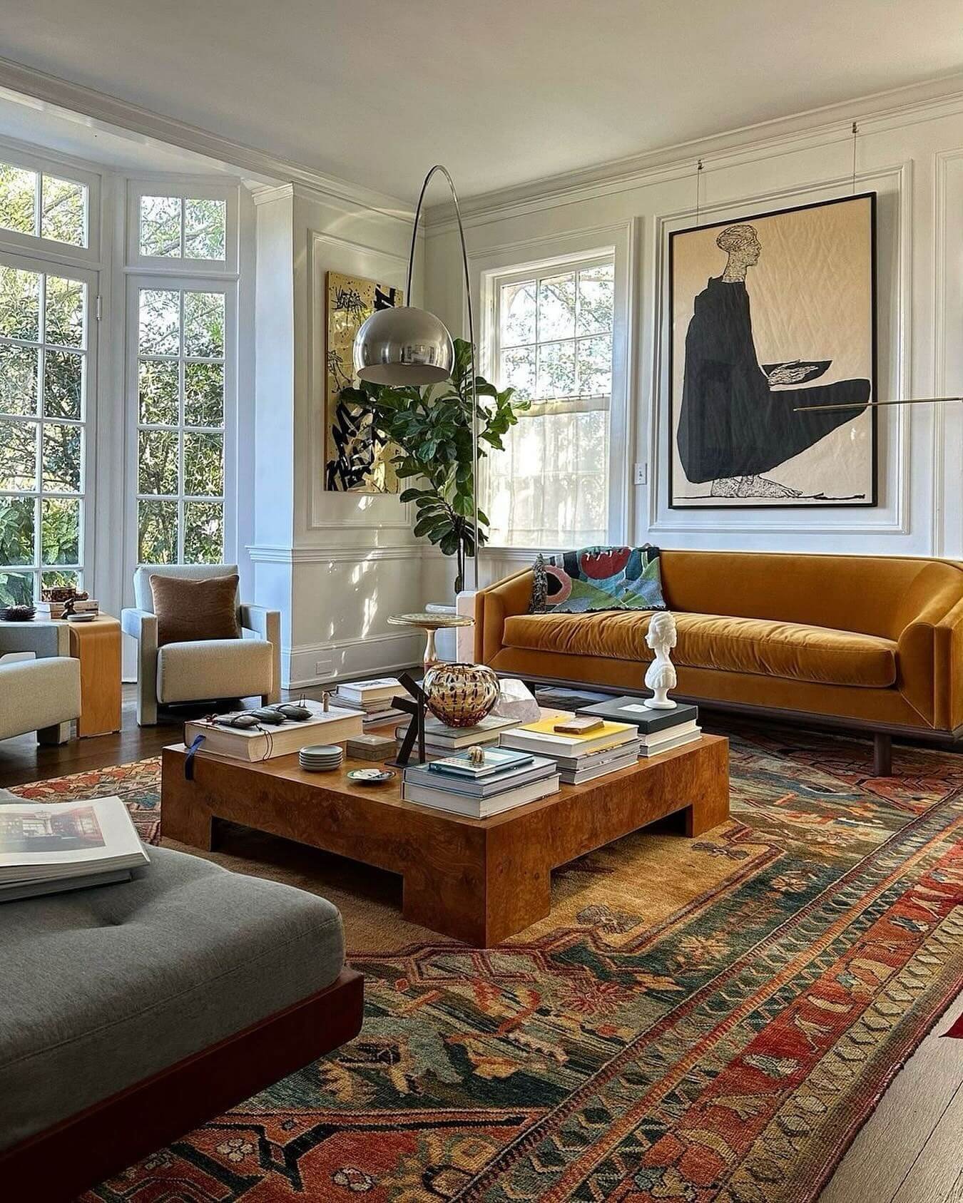 Mustard sofa and warm wood table create a stylish living space