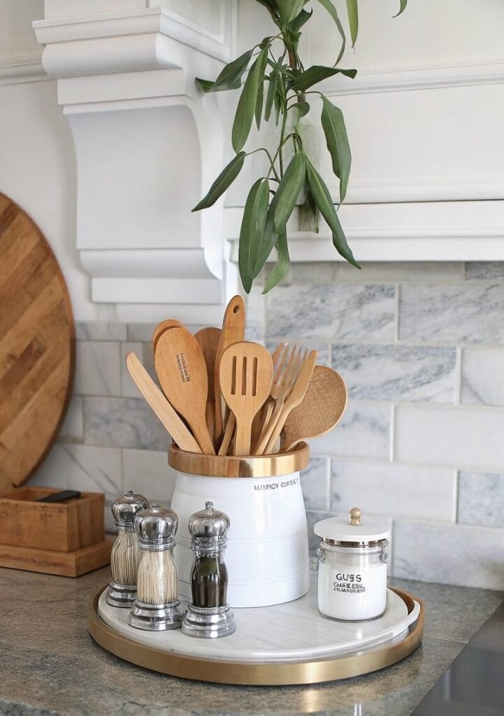 Elegant Kitchen Counter Styling with Wooden Utensils and Marble Tray